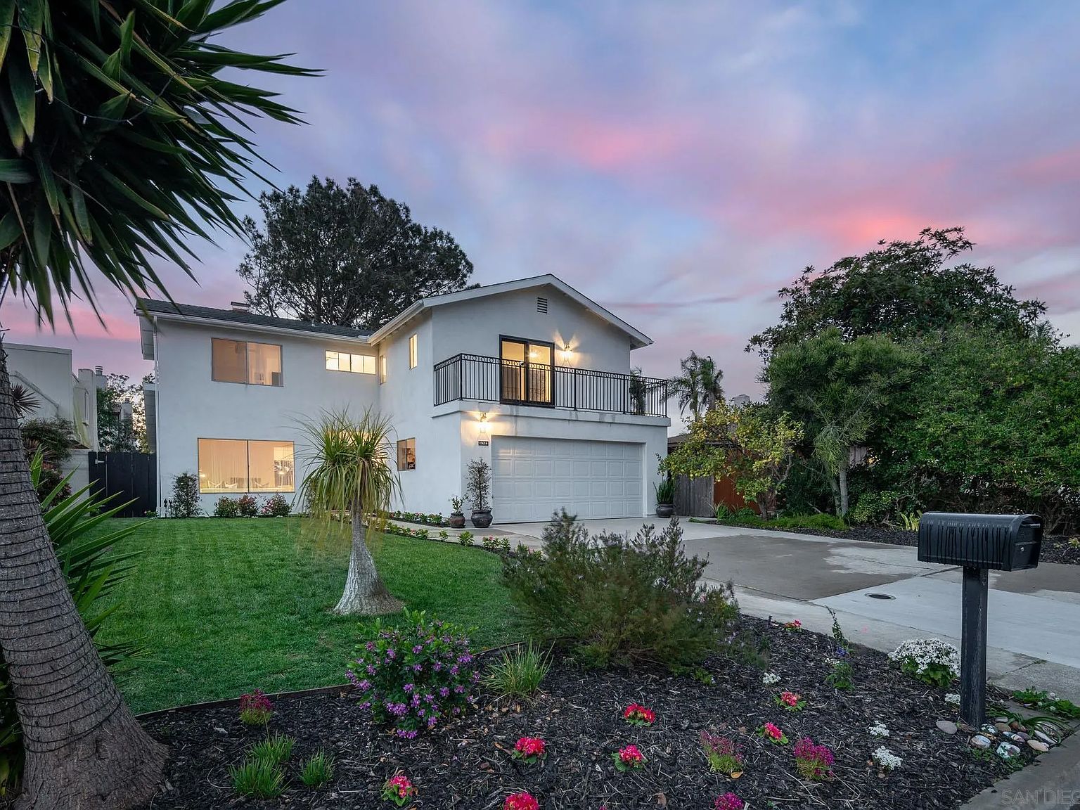 Front elevation of the Del Mar residence at twilight