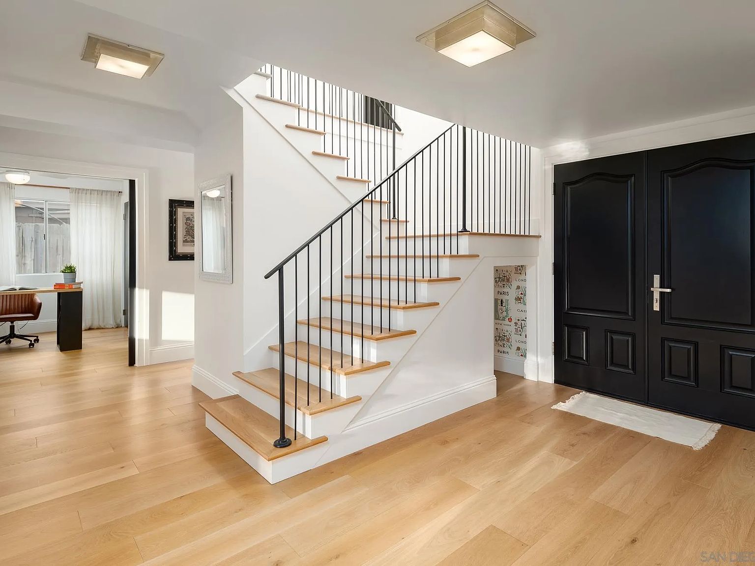 Entry hall with oak staircase and adjoining home office