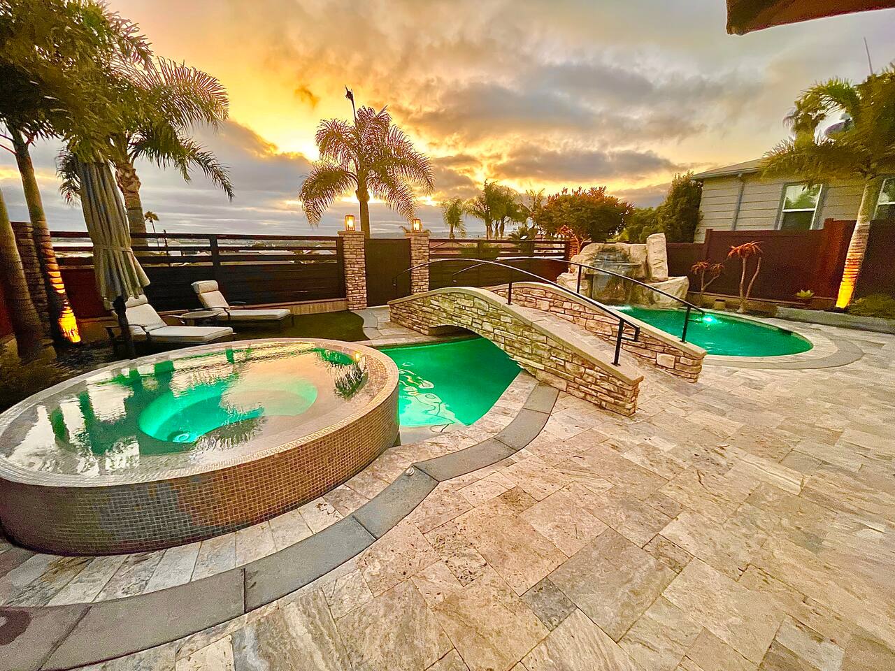 Travertine pool deck with spa and shaded seating