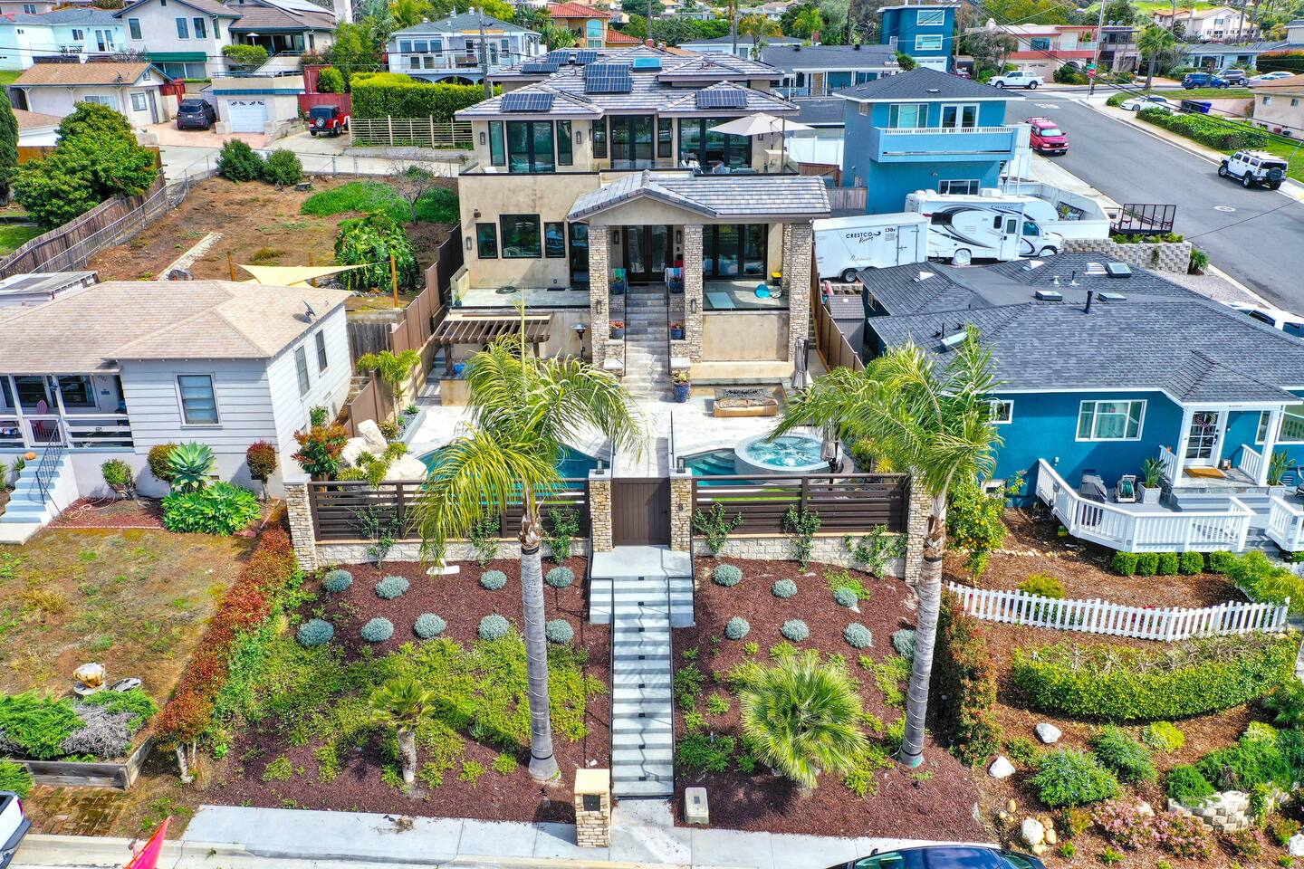 Aerial view of the residence within the coastal neighborhood