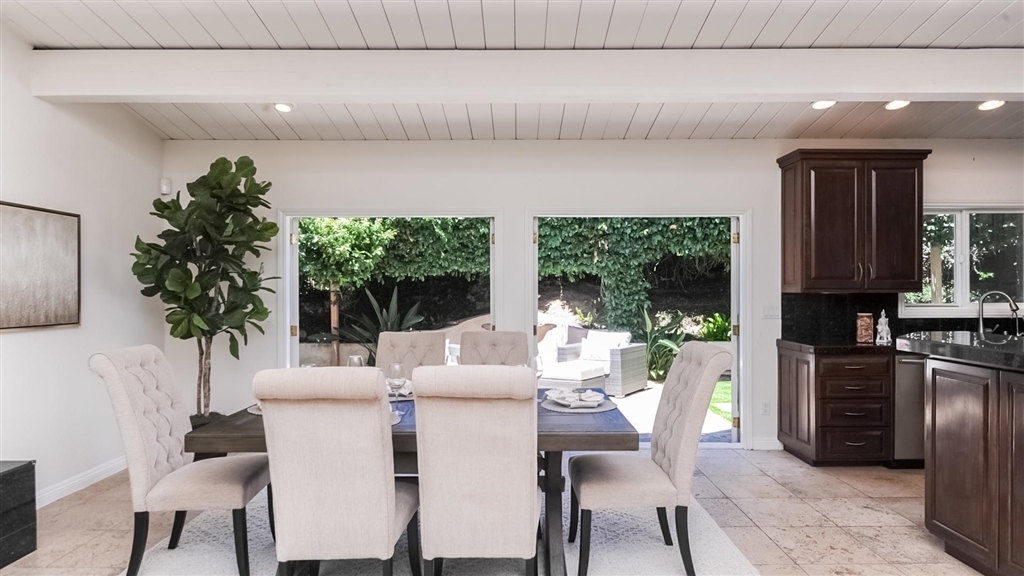 Dining area adjoining the kitchen with garden views