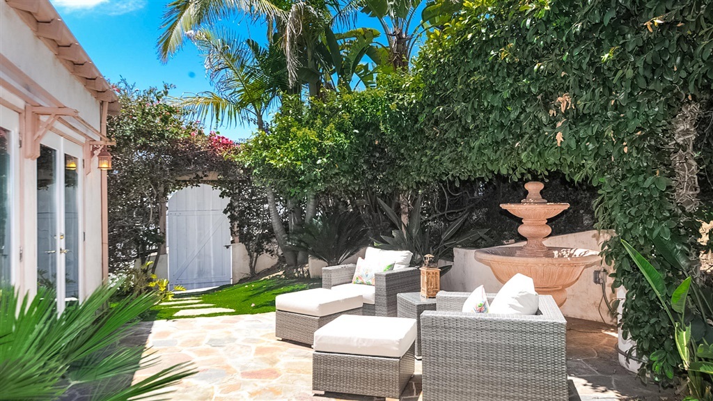 Private flagstone patio with lounge seating and fountain