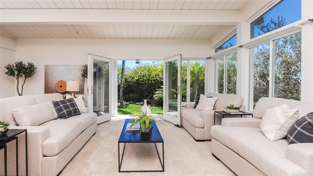 Second living area with deck access and vaulted ceilings